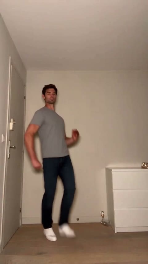 Frame from the original Toc Toc dance clip: a man in a grey T-shirt dancing in a plain room